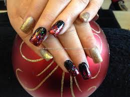 Red and gold nails are seriously trending right now. Acrylic Red And Gold Glitter Nails Nail And Manicure Trends
