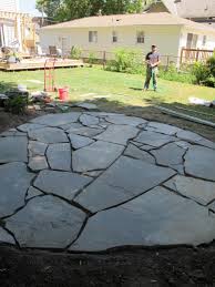 a flagstone patio with irregular stones