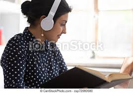 Smart indian girl in headphones studying at laptop. Concentrated smart  indian girl sit at desk wearing headphones studying | CanStock