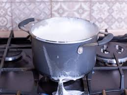 to clean burnt milk from your stove top