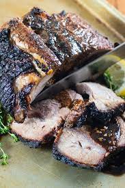 marinated bbq pork roast bbqing with