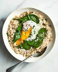 savory oatmeal with spinach and poached