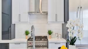 Continue sticking tiles to your wall until you've covered the entire area, cutting them to size if necessary. How To Install A Kitchen Tile Backsplash In 5 Easy Steps