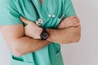 Unrecognizable crop man in wristwatch with stethoscope ...