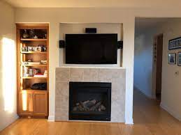fireplace mantel with tv mounted