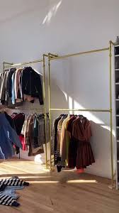 This particular drying rack is designed to fit as close to the wall as possible so that it does not occupy any space. Woman Makes Chic Diy Hanging Closet Wall With Gold Racks From Amazon