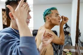 young guys doing their makeup in