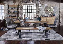 Concrete furniture with blocky silhouettes captures the essence. Dining Room Furniture Furniture Village