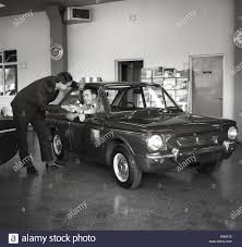 1965 Historical A Man In Singer Car Showroom Sitting In A