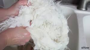 Once the sheepskin has been brushed, fill a bath with cold water and add a wool shampoo specifically designed for sheepskin rugs. How To Clean A Faux Sheepskin Rug Youtube
