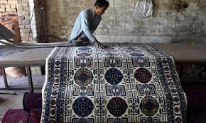stani workers make carpets in
