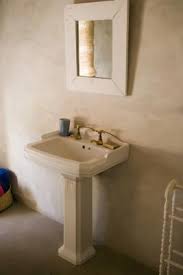 a pedestal sink to the wall without studs