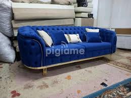 round deep tufted blue 3 seater sofa in