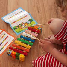wooden xylophone with song sheets and