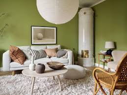 a green living room and a blue bedroom