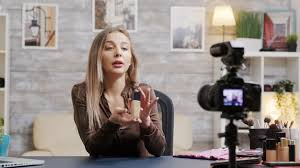beautiful beauty vlogger filming makeup