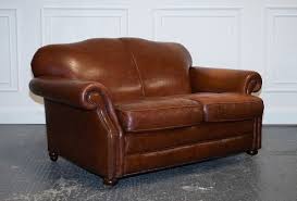 brown leather hump back 2 seater sofa