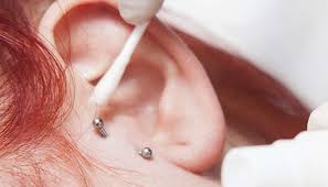 infected tragus piercing symptoms