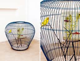This large custom made two part bird cage has been made of gilt iron with two half round copper inserts. Aquarium And Bird In A Cage Design The Concept Duplex Interior Design Ideas Ofdesign