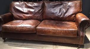 aged vintage leather sofas chairs