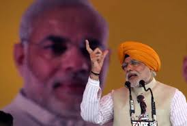 Heady mix: Modi, Rahul show headgears are a must-have on campaign trail. BJP&#39;s prime ministerial candidate Narendra Modi addresses &quot;Fateh Rally&quot; at Jagroan ... - modi-41