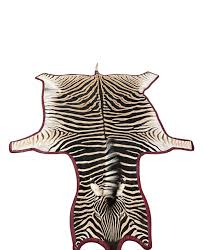 gomez zebra hide rug in burgundy