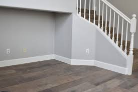 Wood floors will be light warm white oak and carpet will be tuftex serendipity in cement. Repose Gray Paint Tall Baseboards Porcelain Tile Floors That Look Like Wood House Flooring Grey Wood Tile Home Renovation