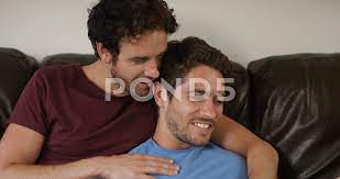 4K Affectionate gay couple relaxing at h... | Stock Video | Pond5