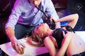 Sexy Striptease Dancer Seducing Man. Beautiful Girl Pulling Man Tie While  Laying On Stage Stock Photo, Picture and Royalty Free Image. Image 28561275.