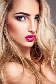 y blonde woman with makeup and blue