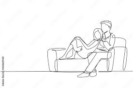man woman couple sitting and hugging