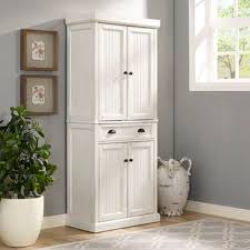 For the ultimate storage cabinet for your pantry, choose an option that an aesthetic rustic style kitchen cabinet of wooden materials in white. Farmhouse Rustic Kitchen Pantry Cabinets Birch Lane