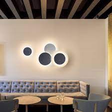 Gallery walls or photo walls have become quite popular over the last few years, providing an easy you can create a gallery wall using your own photographs and art and purchase suitably sized. Vibia Puck Wall Art 5471 Wall Light At Nostraforma