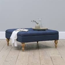 Everywhere you look, you'll see decor spreads that replace the living room's old, faithful coffee table with one or two ottomans. Clover Buttoned Coffee Table Navy Linen 265 00 Go Furniture Co Uk