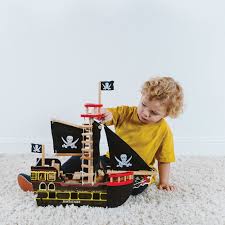 Pirate ship with jolly roger flag and black sails, and traditional sailboats. Buy Le Toy Van Kids Barbarossa Pirate Ship Amara
