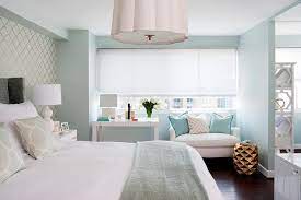 Layering a small master bedroom in multiple tones of white creates an atmosphere of tranquility and spaciousness. Master Bedroom Desk Below Window Transitional Bedroom