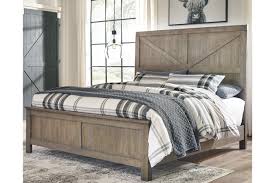This set features a warm, classic look with a rich, burnished deep brown finish, decorative framed details, and stylish turned bun feet that all create a timeless feel. Aldwin Queen Panel Bed Ashley Furniture Homestore
