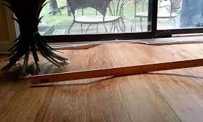 how to prevent hardwood buckling during