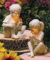 With Solar Fireflies Garden Statues