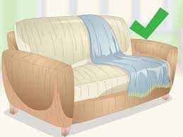 3 ways to d a throw over a sofa