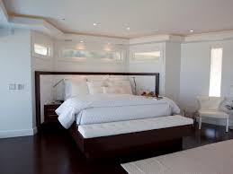 modern bedroom with dark wood floors