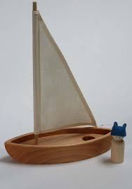 wooden sailboat white sail the
