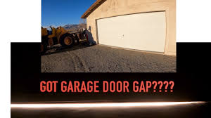 fixing garage door gap uneven floor