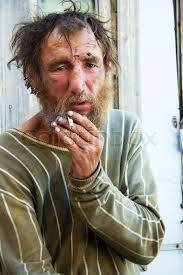 Homeless man on a city street | Stock image | Colourbox
