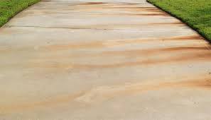 what causes rust stains on concrete