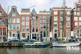 Multistorey office and residential buildings along canal, Amsterdam, Noord- Holland, Netherlands, Stock Photo, Picture And Royalty Free Image. Pic.  CUL-IS09BY57R | agefotostock