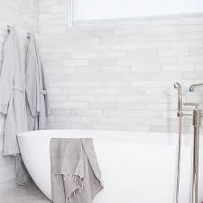 light gray herringbone bathroom tiles