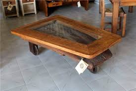 This rustic coffee table is a storage haven for any farmhouse style decor. Rustic Coffee Table 62 66 El Roure Vell Wooden Glass Wooden Base