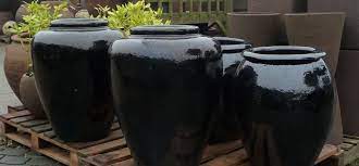 large black glazed pots and planters
