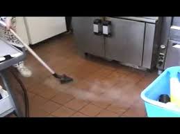 steam cleaner cleaning grease and grime